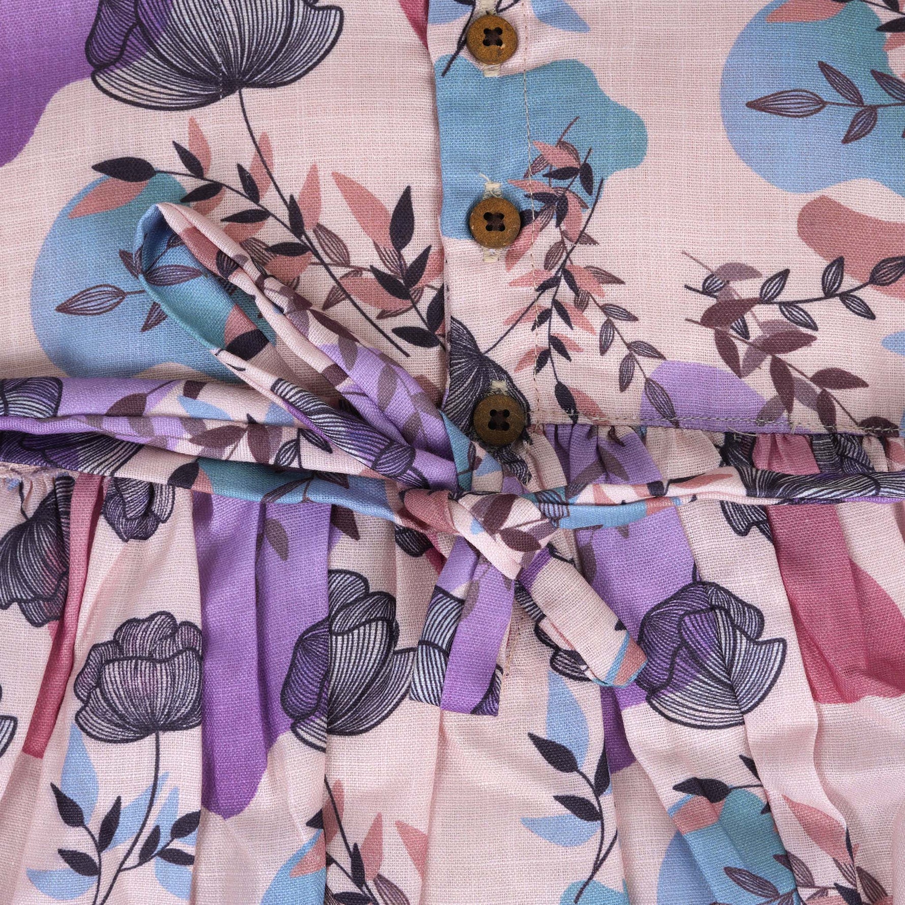 Sleeveless frock for girls aged 1 to 4 years in slub cotton, featuring abstract floral pastel print in lavender, pink, blue, and beige – from Boon Babies, Coimbatore.