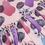 Sleeveless frock for girls aged 1 to 4 years in slub cotton, featuring abstract floral pastel print in lavender, pink, blue, and beige – from Boon Babies, Coimbatore.