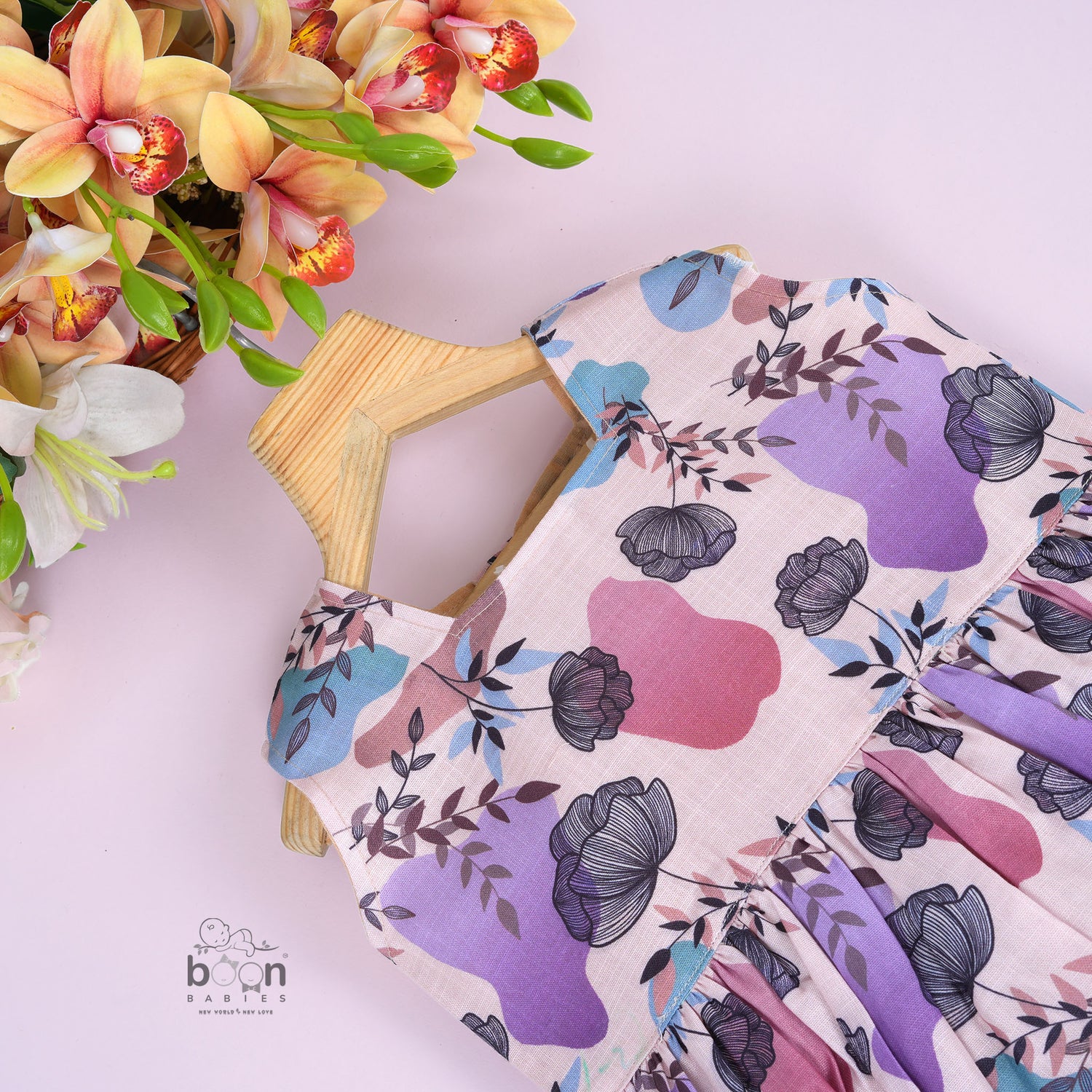 Sleeveless frock for girls aged 1 to 4 years in slub cotton, featuring abstract floral pastel print in lavender, pink, blue, and beige – from Boon Babies, Coimbatore.