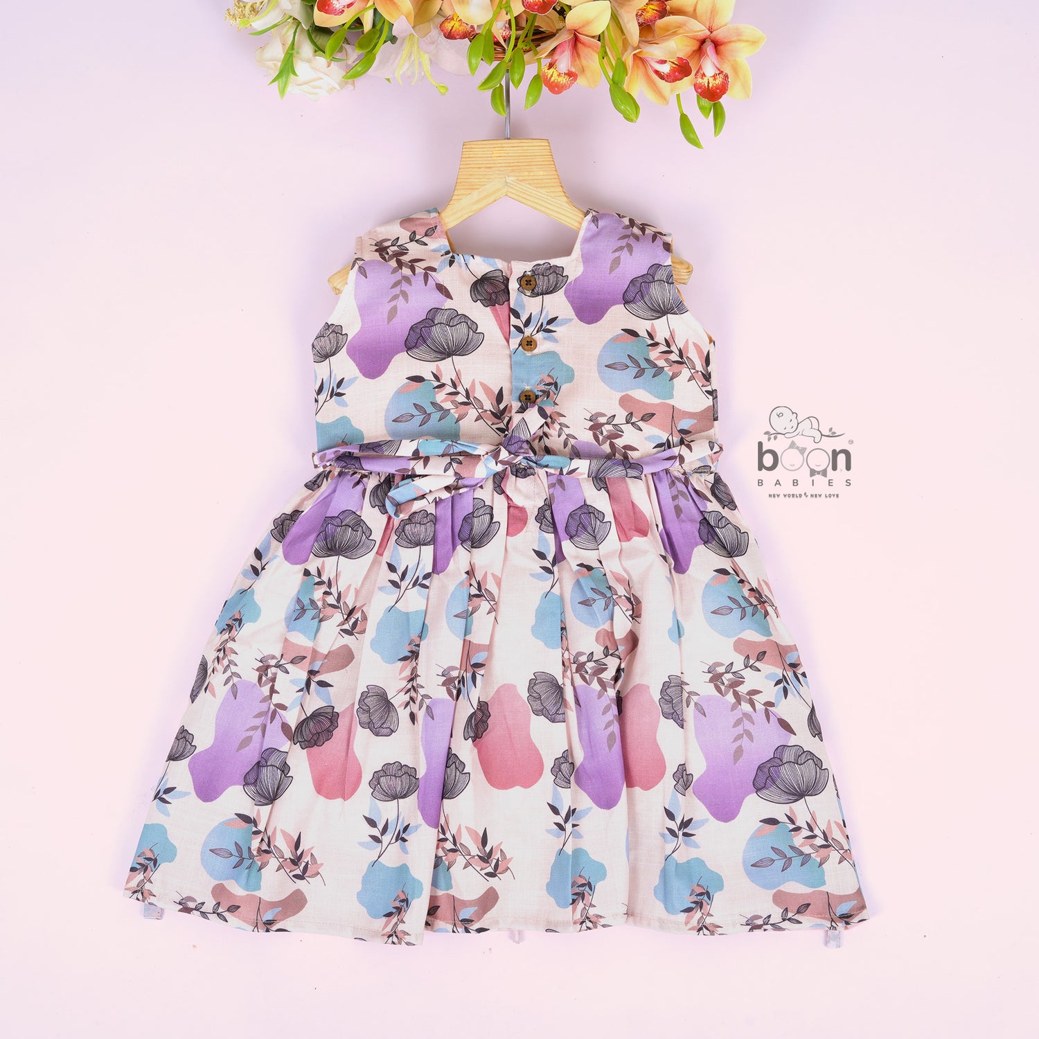 Sleeveless frock for girls aged 1 to 4 years in slub cotton, featuring abstract floral pastel print in lavender, pink, blue, and beige – from Boon Babies, Coimbatore.