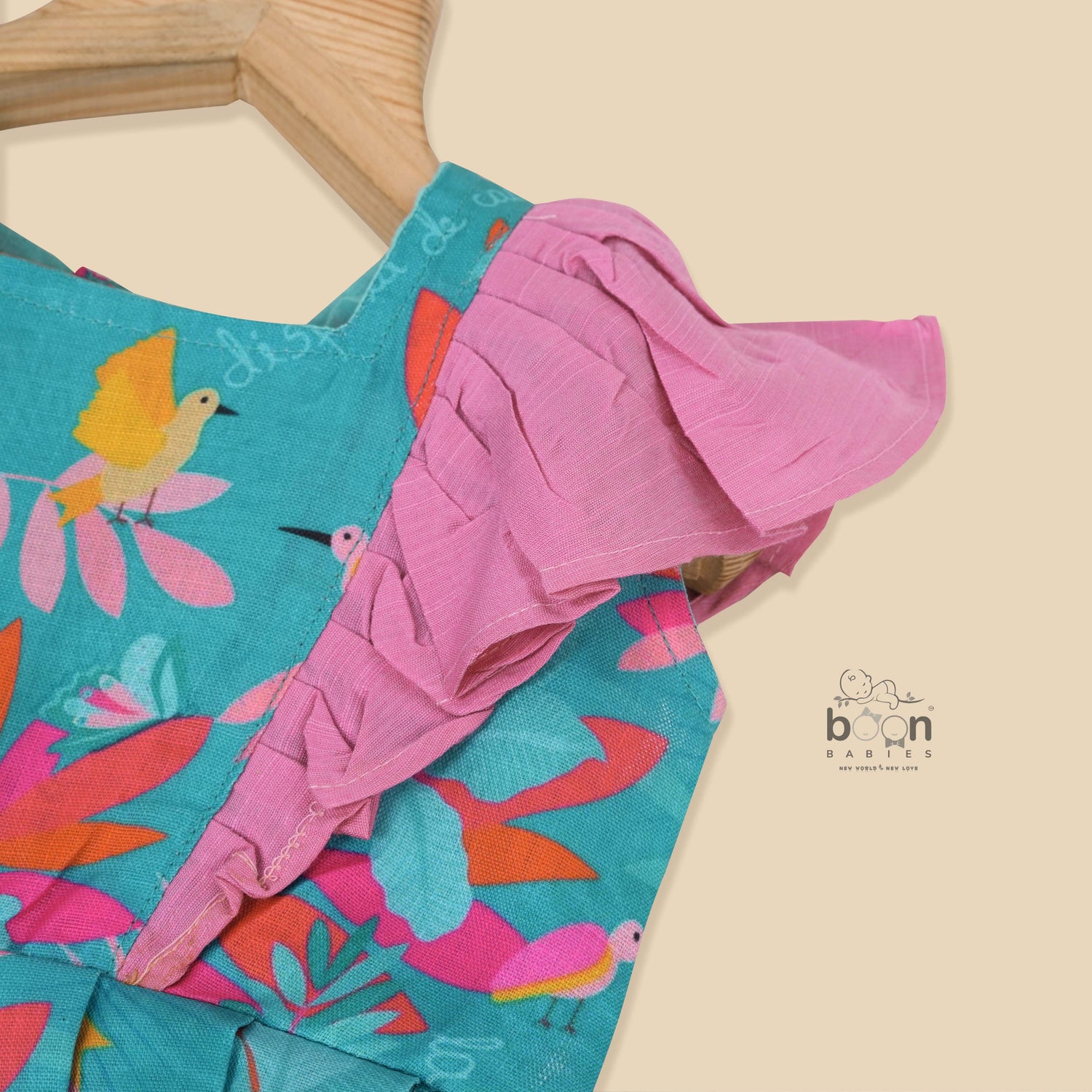 Girls digital printed slub cotton frock with tropical bird & leaf design + ruffle frills (1–4Y). Stylish, comfy & perfect for festive or casual wear.