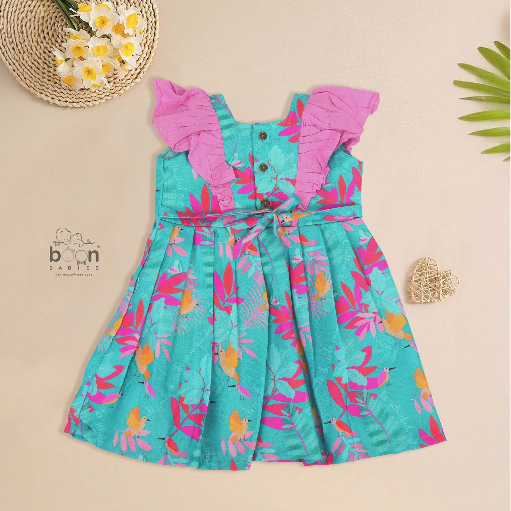Girls digital printed slub cotton frock with tropical bird & leaf design + ruffle frills (1–4Y). Stylish, comfy & perfect for festive or casual wear.