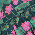 Sleeveless dark green frock for girls aged 1 to 4 years, featuring pink lotus floral print in slub cotton – from Boon Babies, Coimbatore.