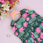 Sleeveless dark green frock for girls aged 1 to 4 years, featuring pink lotus floral print in slub cotton – from Boon Babies, Coimbatore.