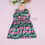 Sleeveless dark green frock for girls aged 1 to 4 years, featuring pink lotus floral print in slub cotton – from Boon Babies, Coimbatore.