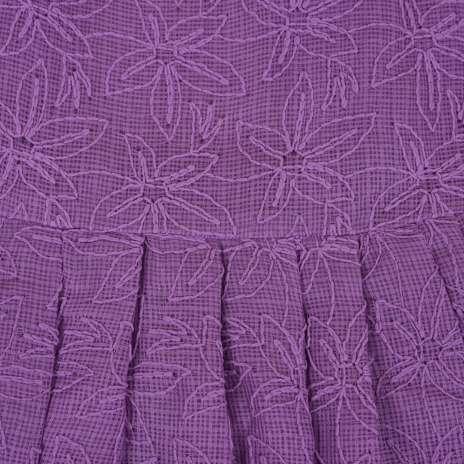 Orchid purple Hakoba frock for baby girls, sleeveless with floral embroidery and pleated skirt, displayed flat on beige background with soft props.