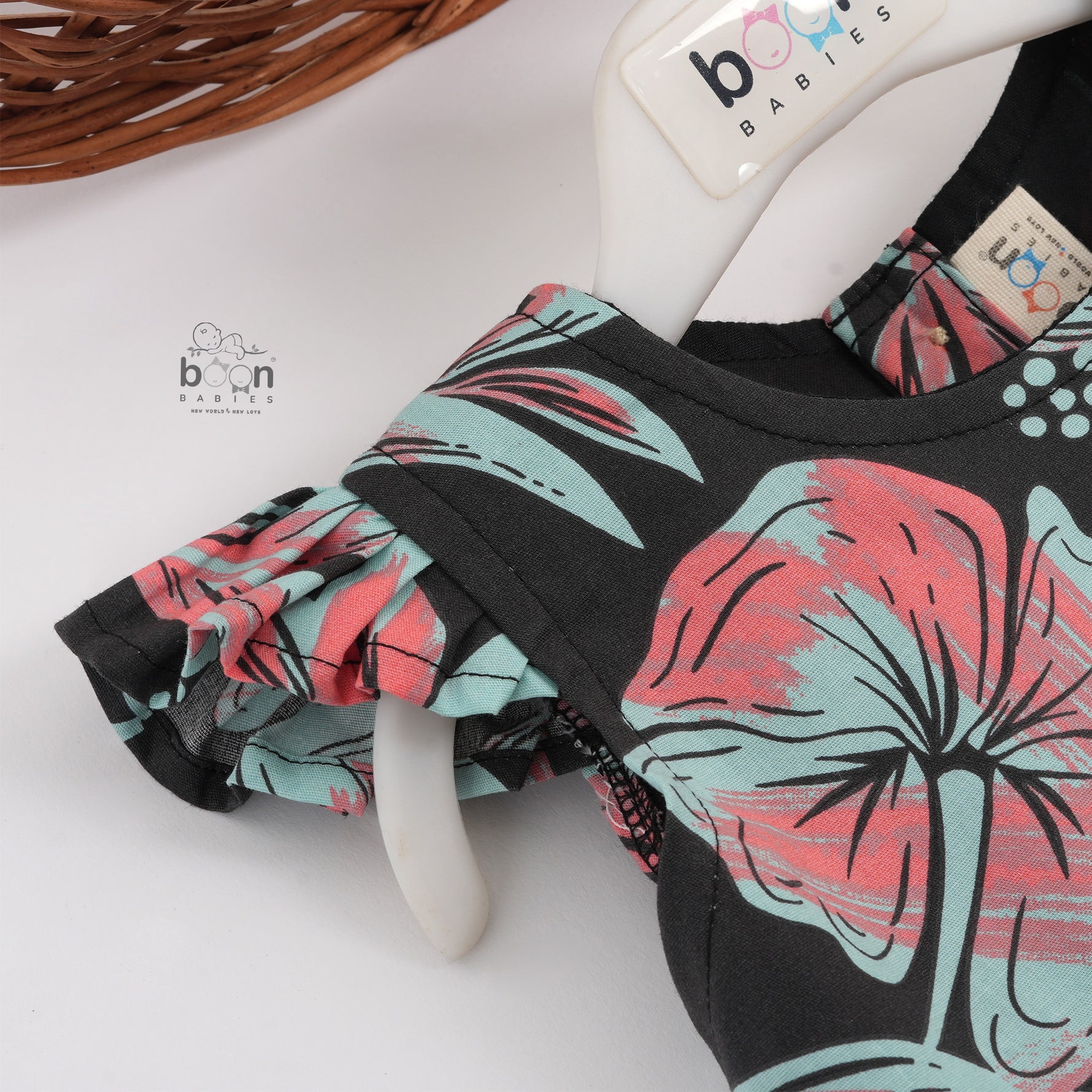 Stylish black cotton frock with floral prints and cap sleeves – comfy wear for girls aged 6M to 5Y.