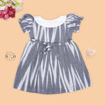 Black & White cotton ikat puff frock with contrast collar & bow. Sizes 6M–4Y. Elegant, comfy & festive-ready.