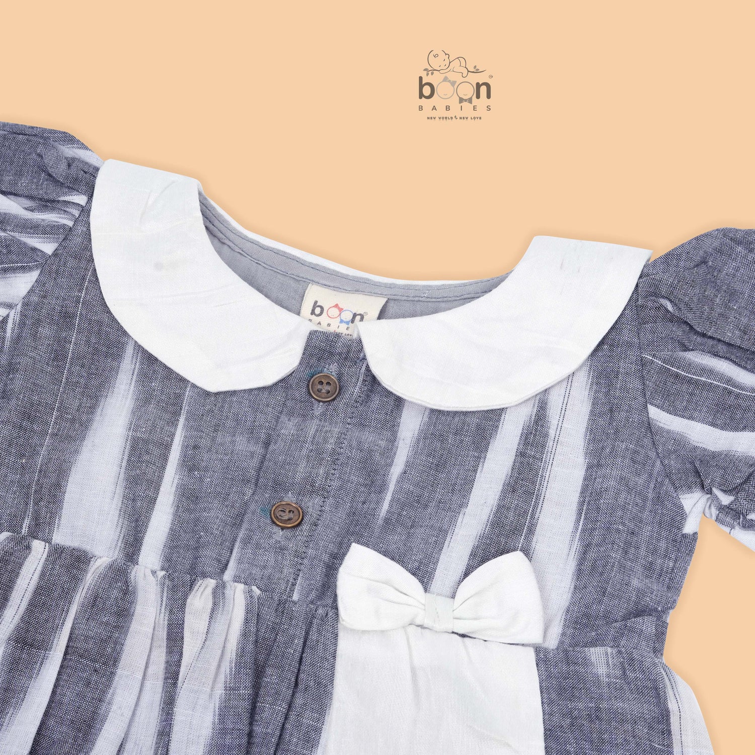 Black & White cotton ikat puff frock with contrast collar & bow. Sizes 6M–4Y. Elegant, comfy & festive-ready.