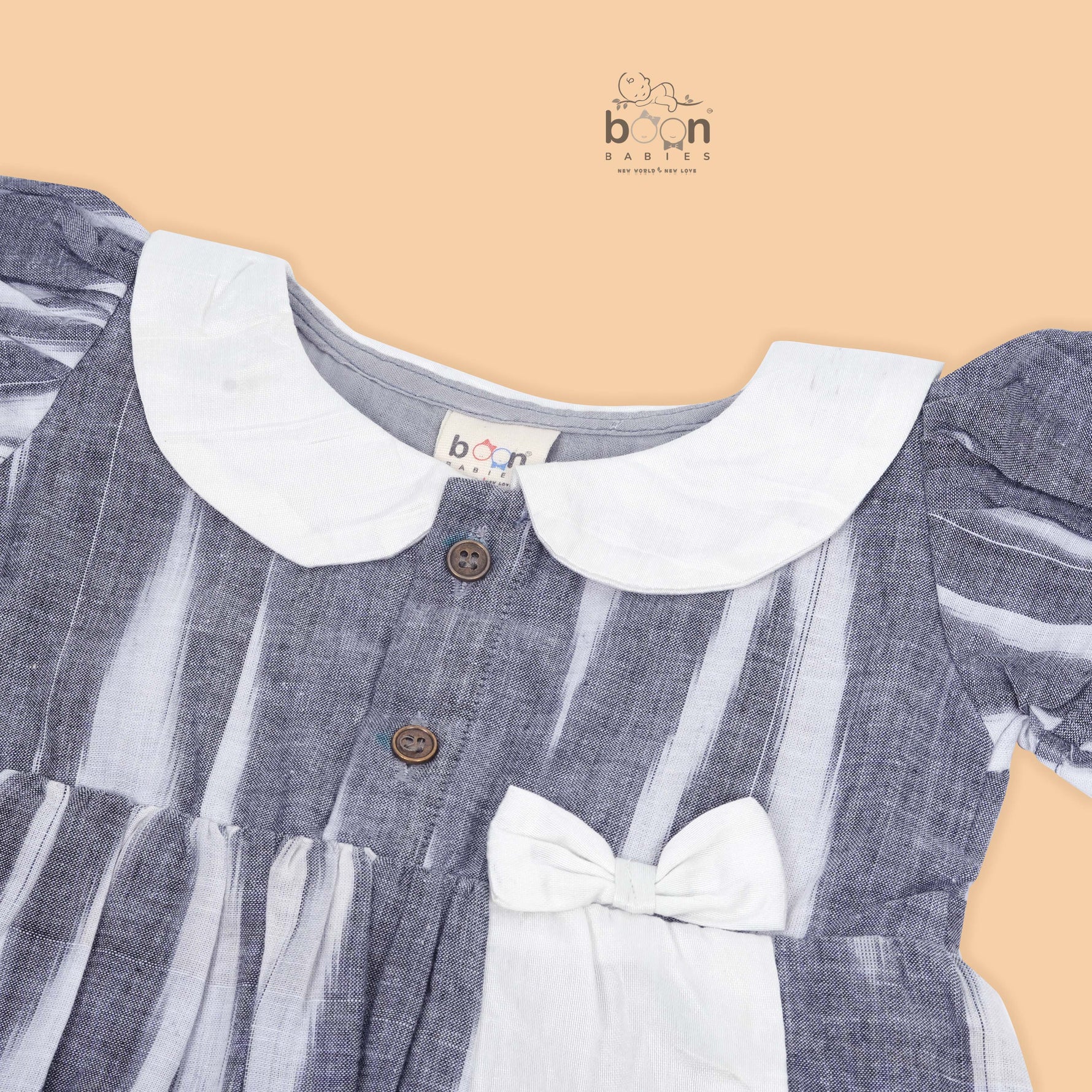 Black & White cotton ikat puff frock with contrast collar & bow. Sizes 6M–4Y. Elegant, comfy & festive-ready.