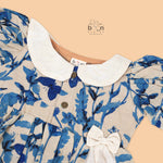 Blue bird print cotton Side Pleated Frock with cream collar & bow. Ages 6M–4Y. Soft, breathable & stylish festive wear for baby girls.