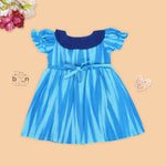 Blue cotton puff frock with navy collar & bow. Sizes 6M–4Y. Stylish, comfy & perfect for festive or casual wear.