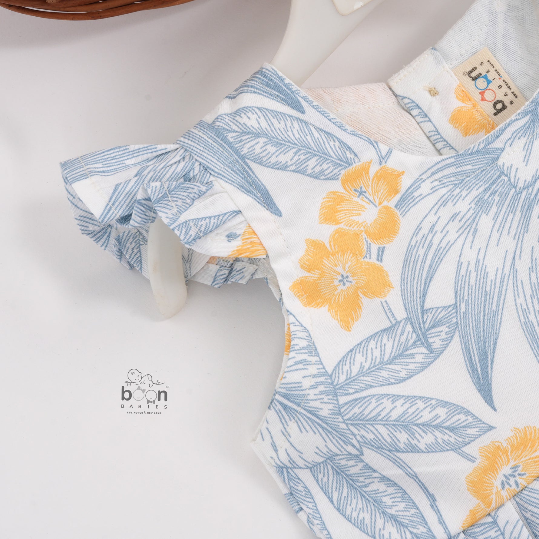 White cotton frock with soft floral prints in blue & yellow. Comfy cap sleeves, perfect for 6M to 5Y girls.