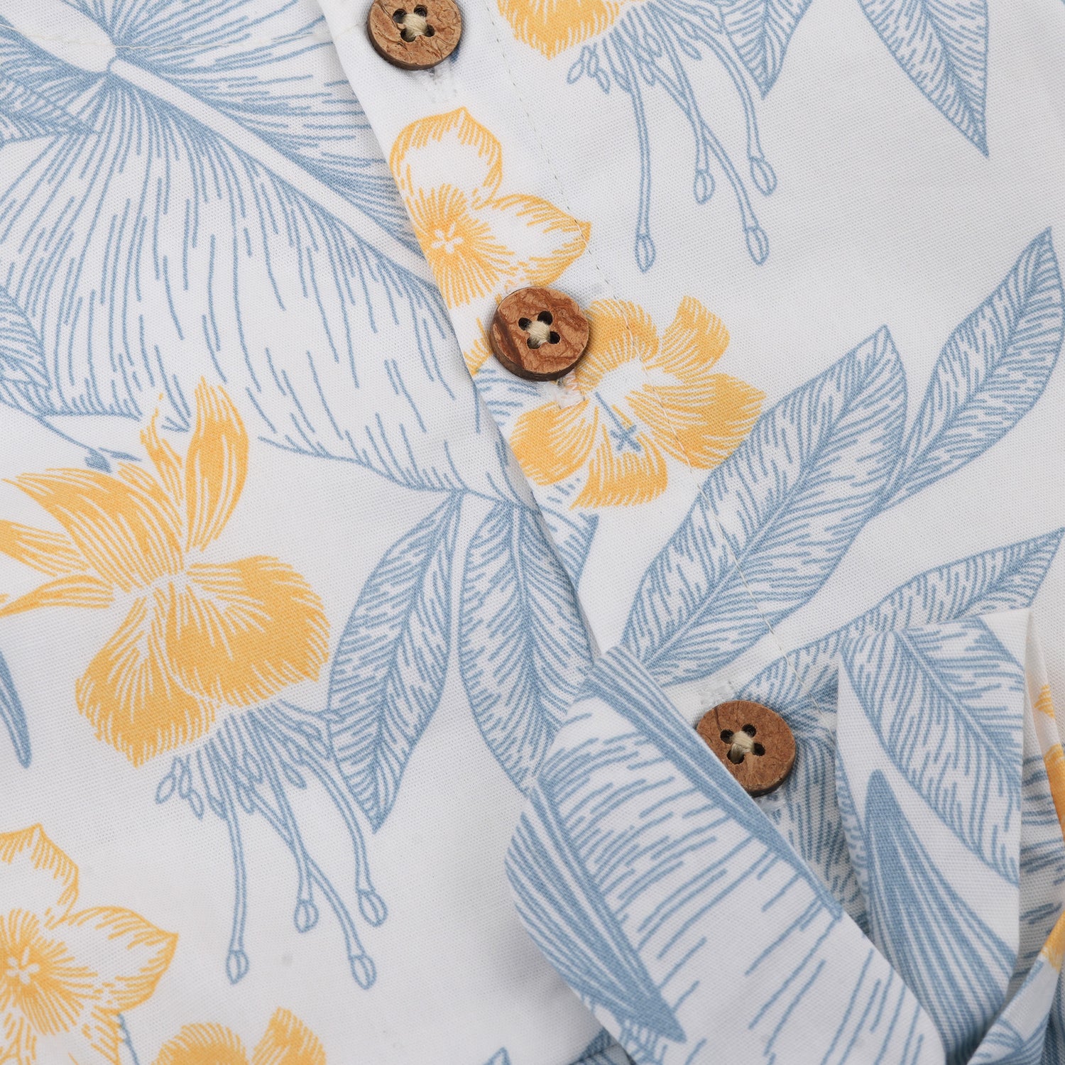 White cotton frock with soft floral prints in blue & yellow. Comfy cap sleeves, perfect for 6M to 5Y girls.