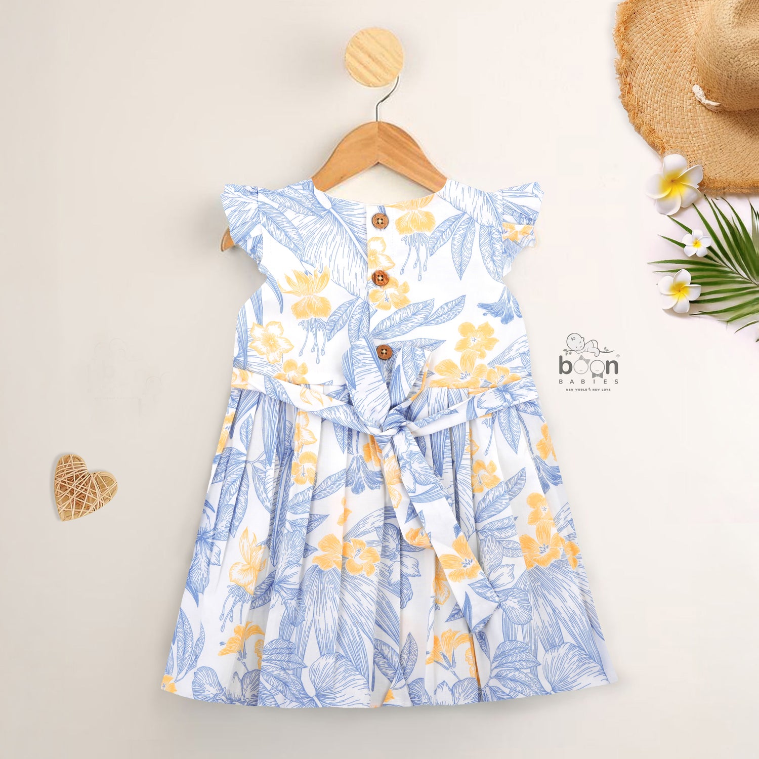 White cotton frock with soft floral prints in blue & yellow. Comfy cap sleeves, perfect for 6M to 5Y girls.