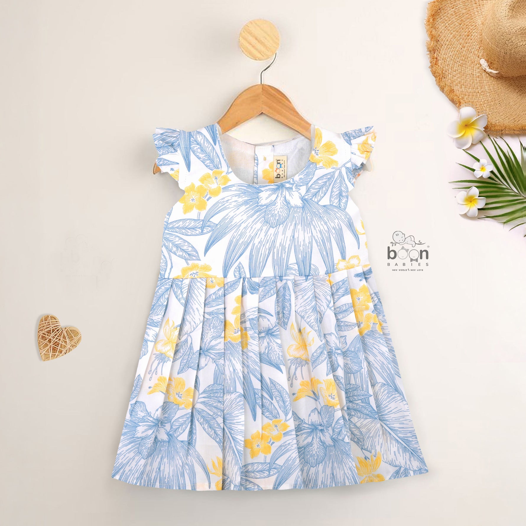 White cotton frock with soft floral prints in blue & yellow. Comfy cap sleeves, perfect for 6M to 5Y girls.