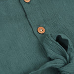 Minimalist bottle green frock in soft cotton. Cap sleeves. Sizes 6M to 5Y. Perfect for play or outings.
