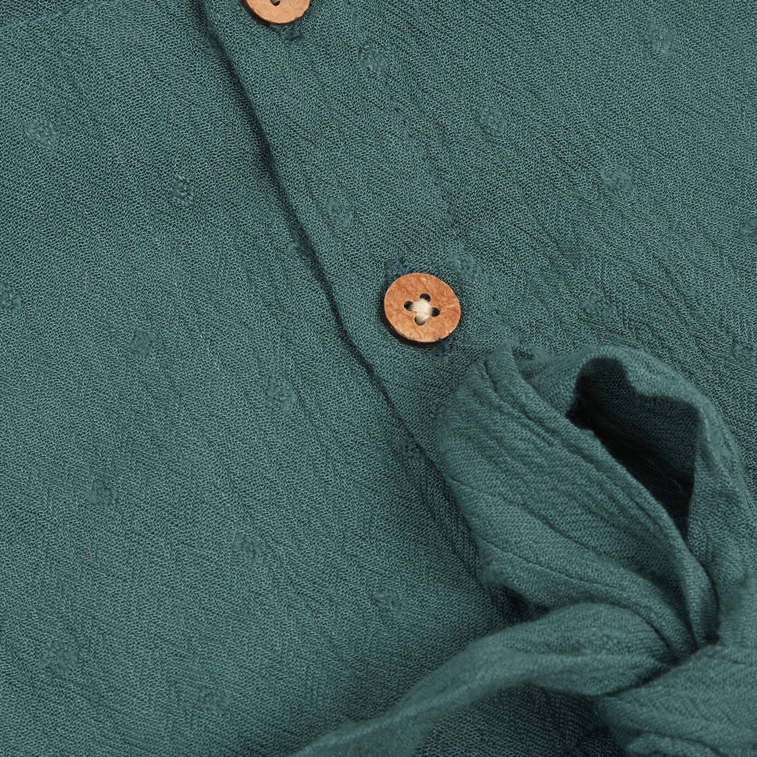 Minimalist bottle green frock in soft cotton. Cap sleeves. Sizes 6M to 5Y. Perfect for play or outings.
