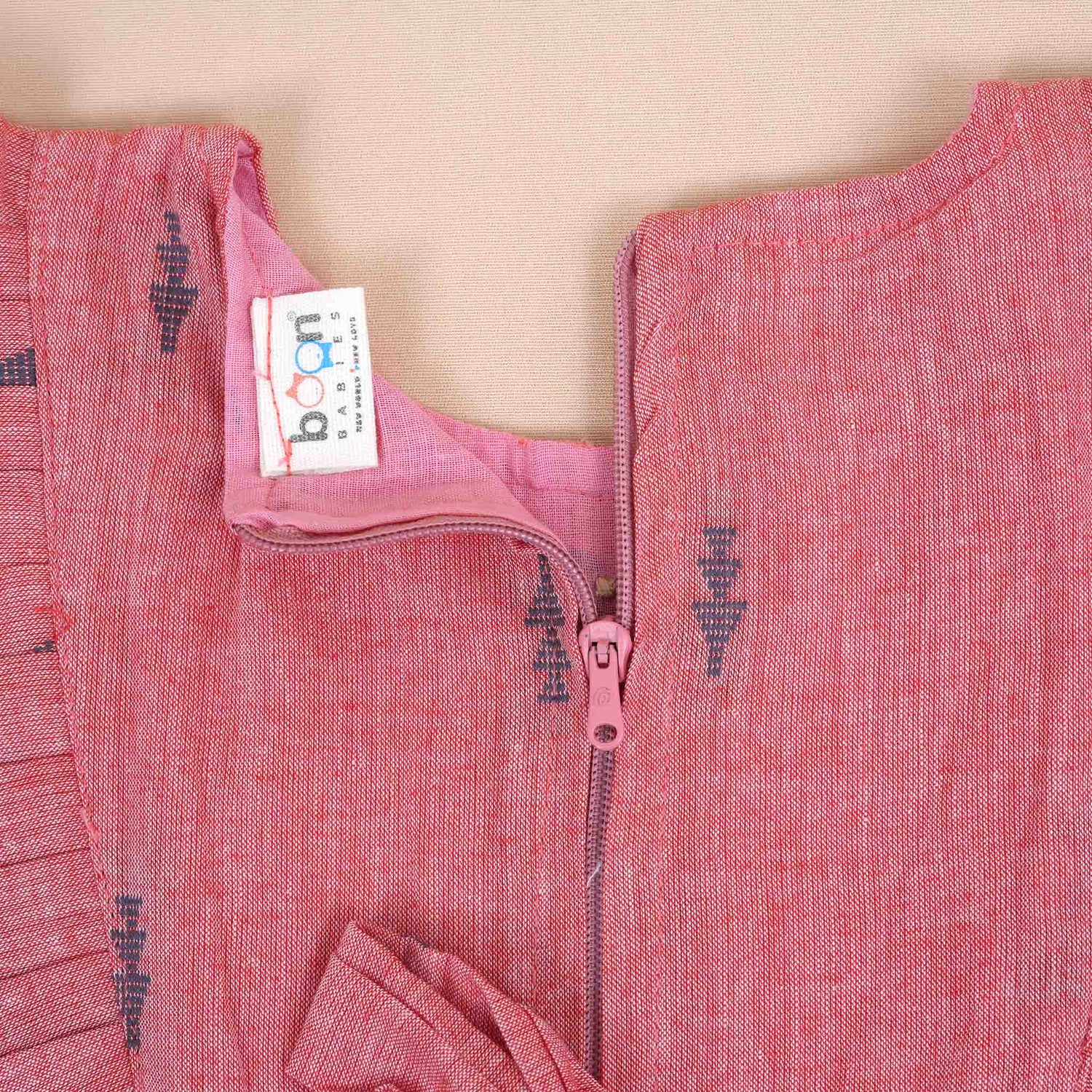 Dusty Pink Girls Printed Frock with Ruffle Sleeves and Wooden Buttons