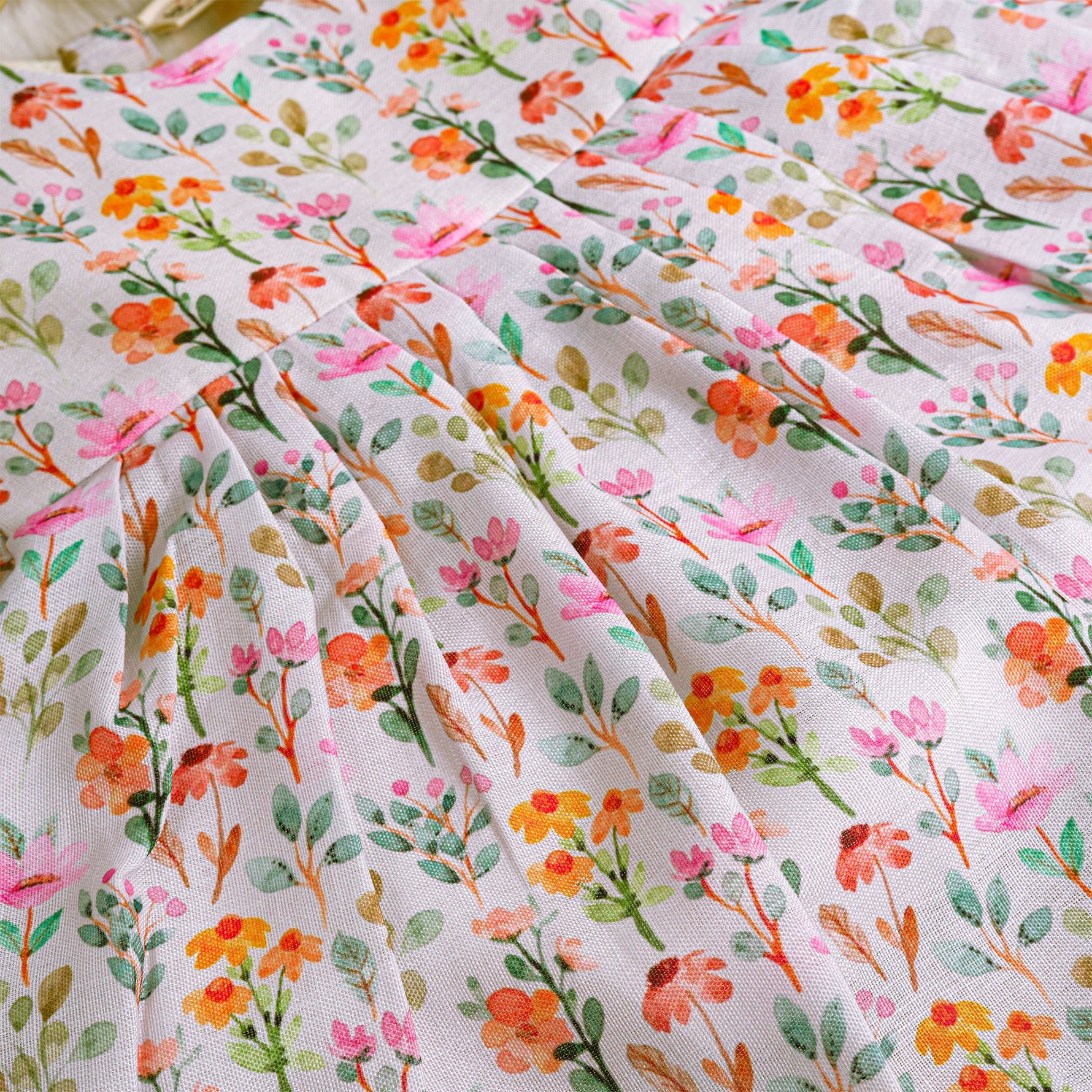 Baby girl in a white sleeveless floral frock made of slub cotton, designed for 6 months to 5 years – part of the Boon Babies kidswear collection in Coimbatore.