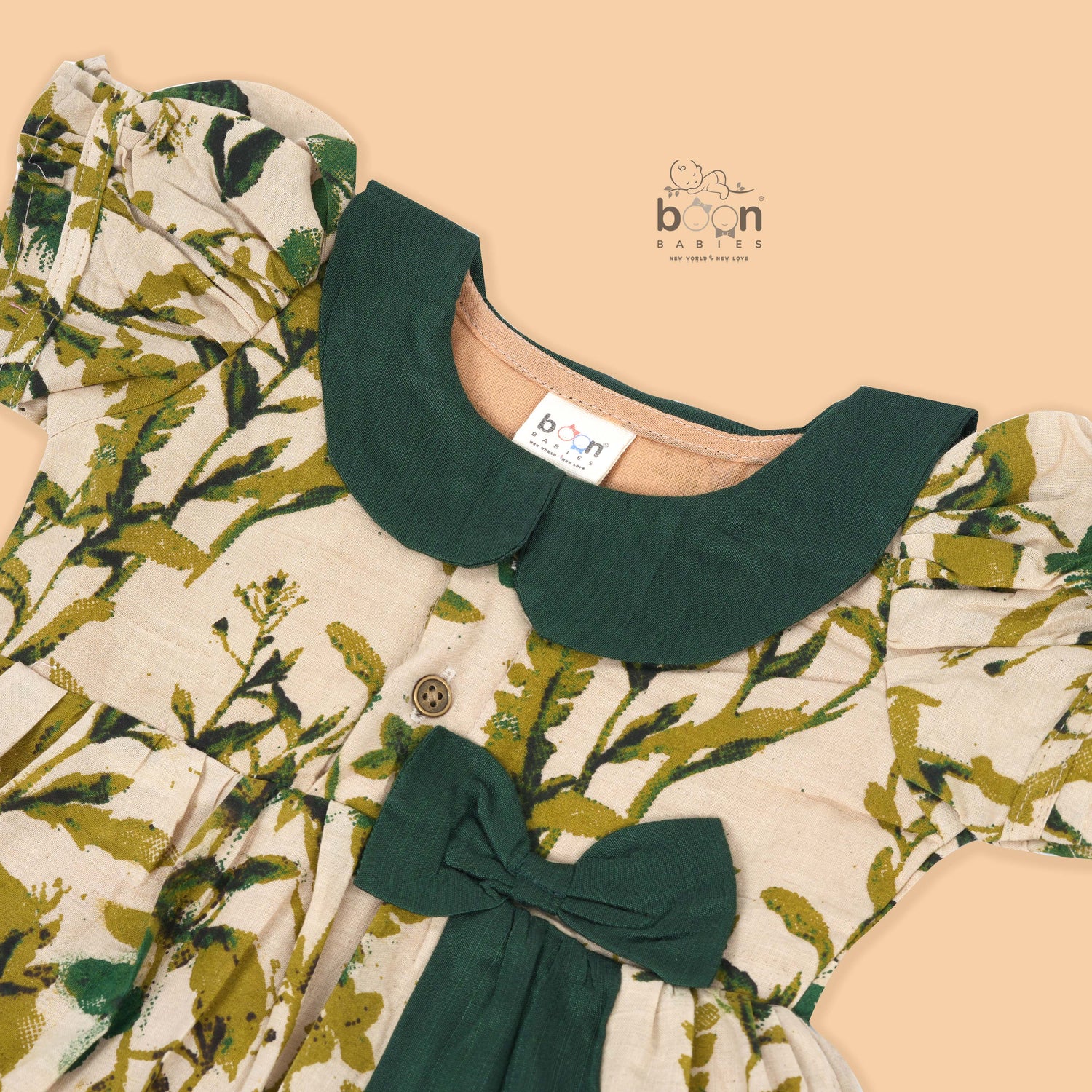 Nature-inspired bird print cotton Side Pleated Frock with green collar & bow. Ages 6M–4Y. Soft, breathable & stylish everyday festive wear.