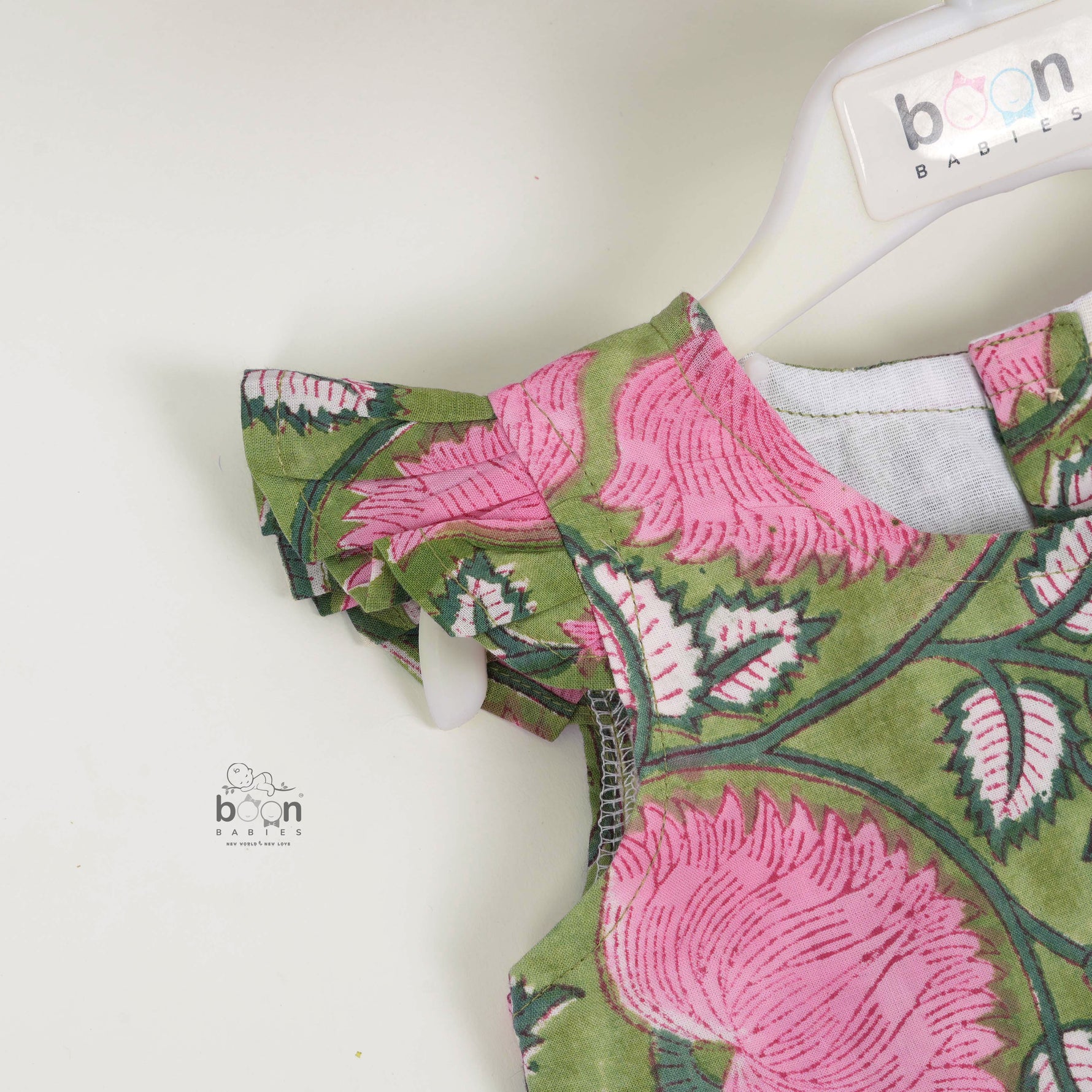 Soft cotton frock with cap sleeves and floral block print. Perfect comfort and style for girls aged 6M–5Y.
