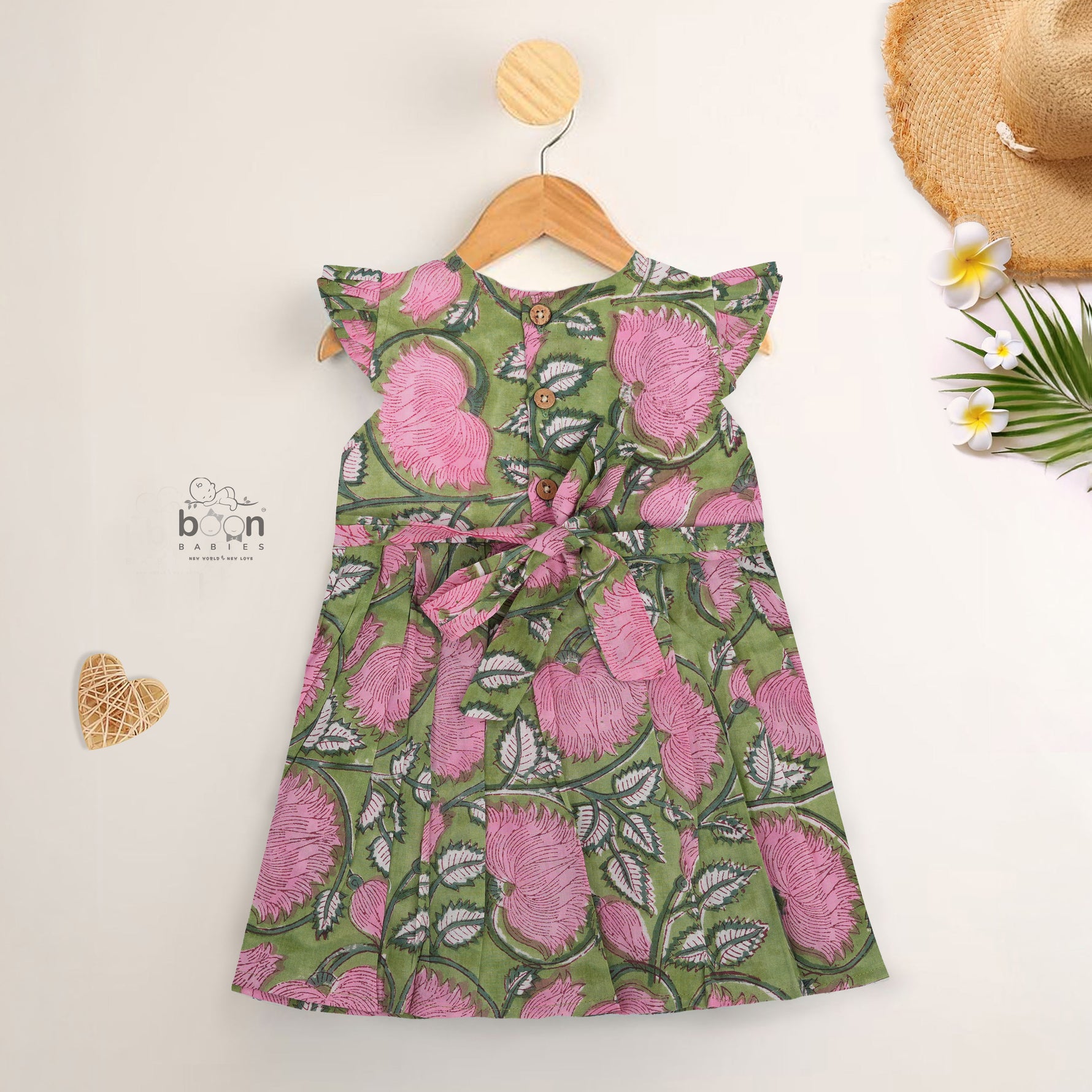 Soft cotton frock with cap sleeves and floral block print. Perfect comfort and style for girls aged 6M–5Y.
