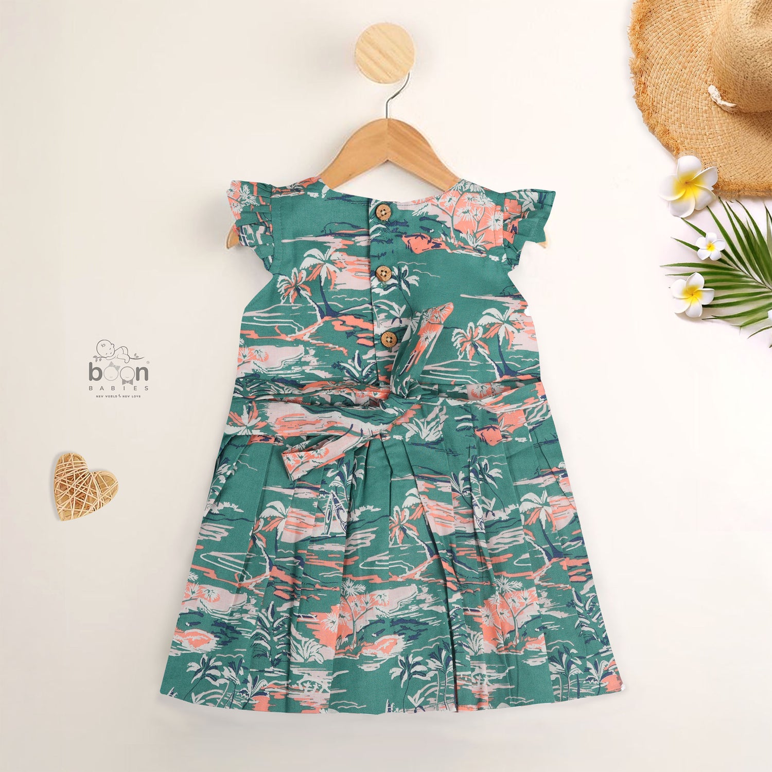 Green cotton frock with tropical island print and cap sleeves for baby girls aged 6 months to 5 years – Boon Babies kidswear collection from Coimbatore.
