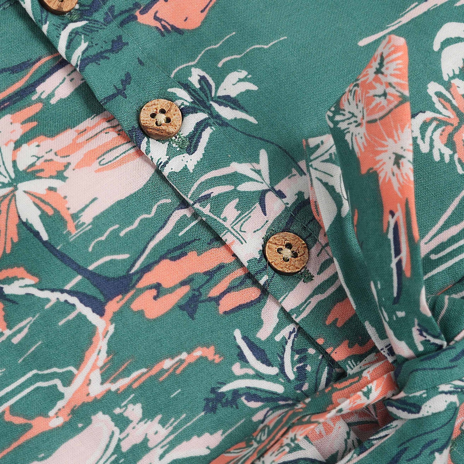 Green cotton frock with tropical island print and cap sleeves for baby girls aged 6 months to 5 years – Boon Babies kidswear collection from Coimbatore.
