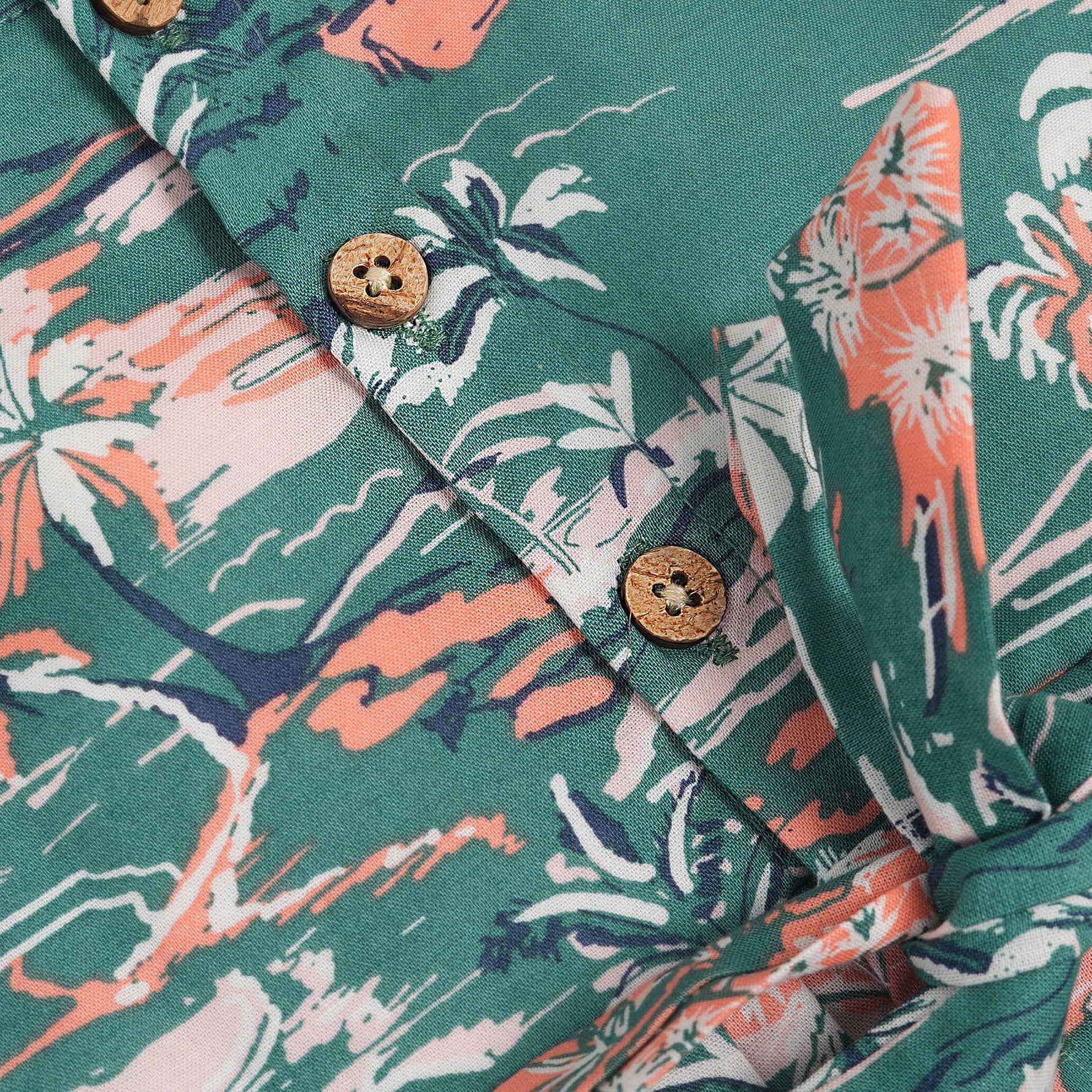 Green cotton frock with tropical island print and cap sleeves for baby girls aged 6 months to 5 years – Boon Babies kidswear collection from Coimbatore.
