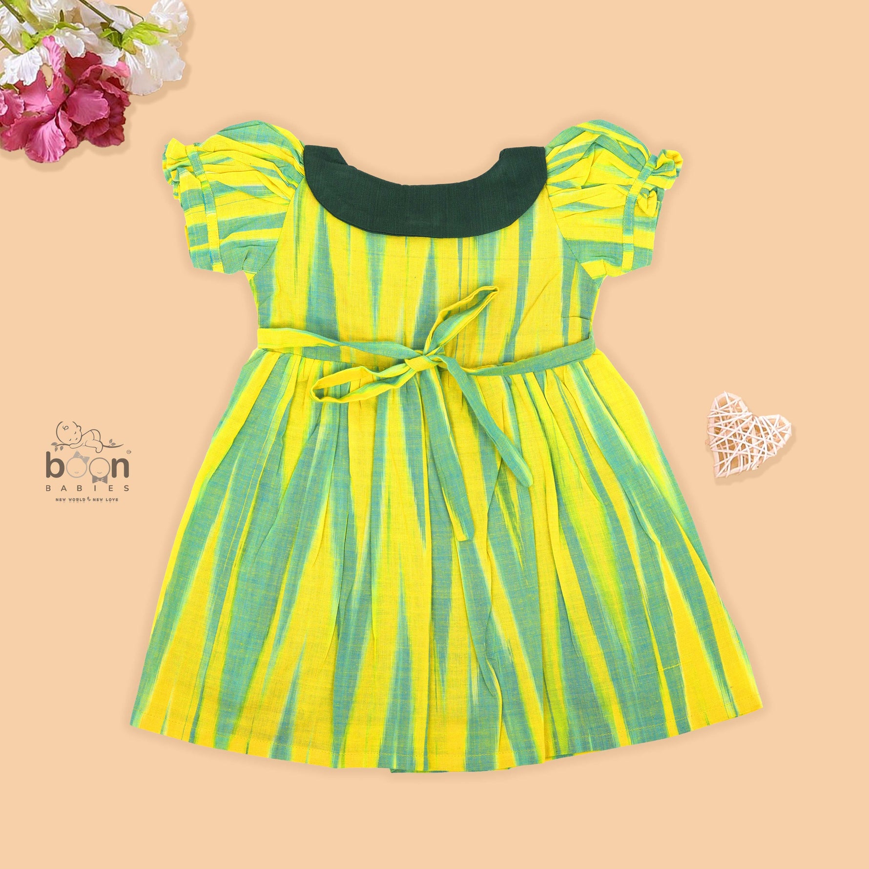 Green & Yellow cotton ikat puff frock with contrast collar & bow. Sizes 6M–4Y. Comfy, ethnic-inspired & festive-ready.