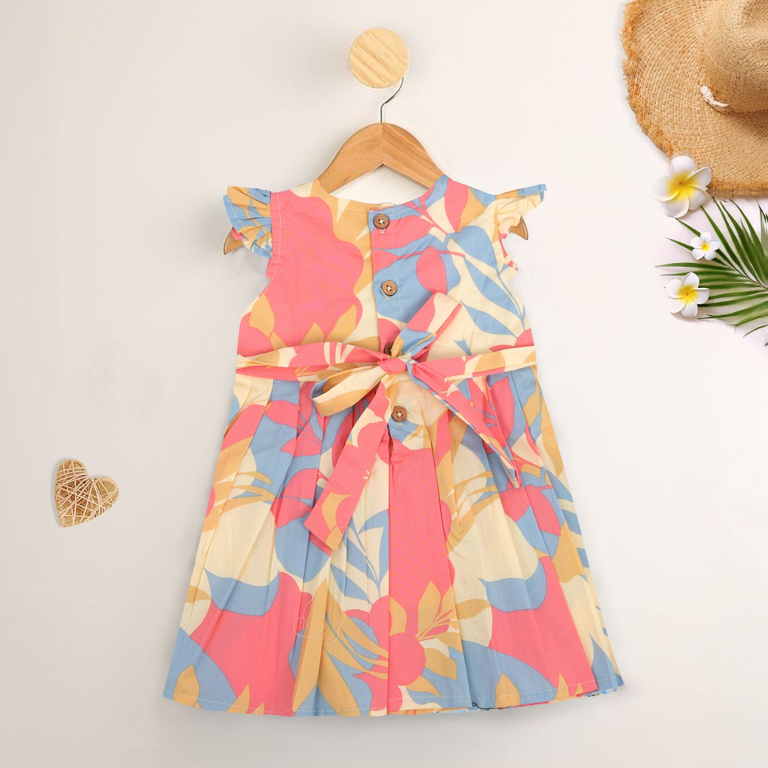 Colorful cotton frock with leaf print and cap sleeves. Ages 6M–5Y. Soft, breathable, and made for twirls!
