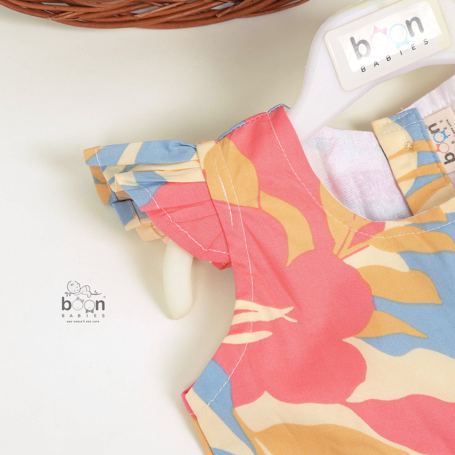 Colorful cotton frock with leaf print and cap sleeves. Ages 6M–5Y. Soft, breathable, and made for twirls!
