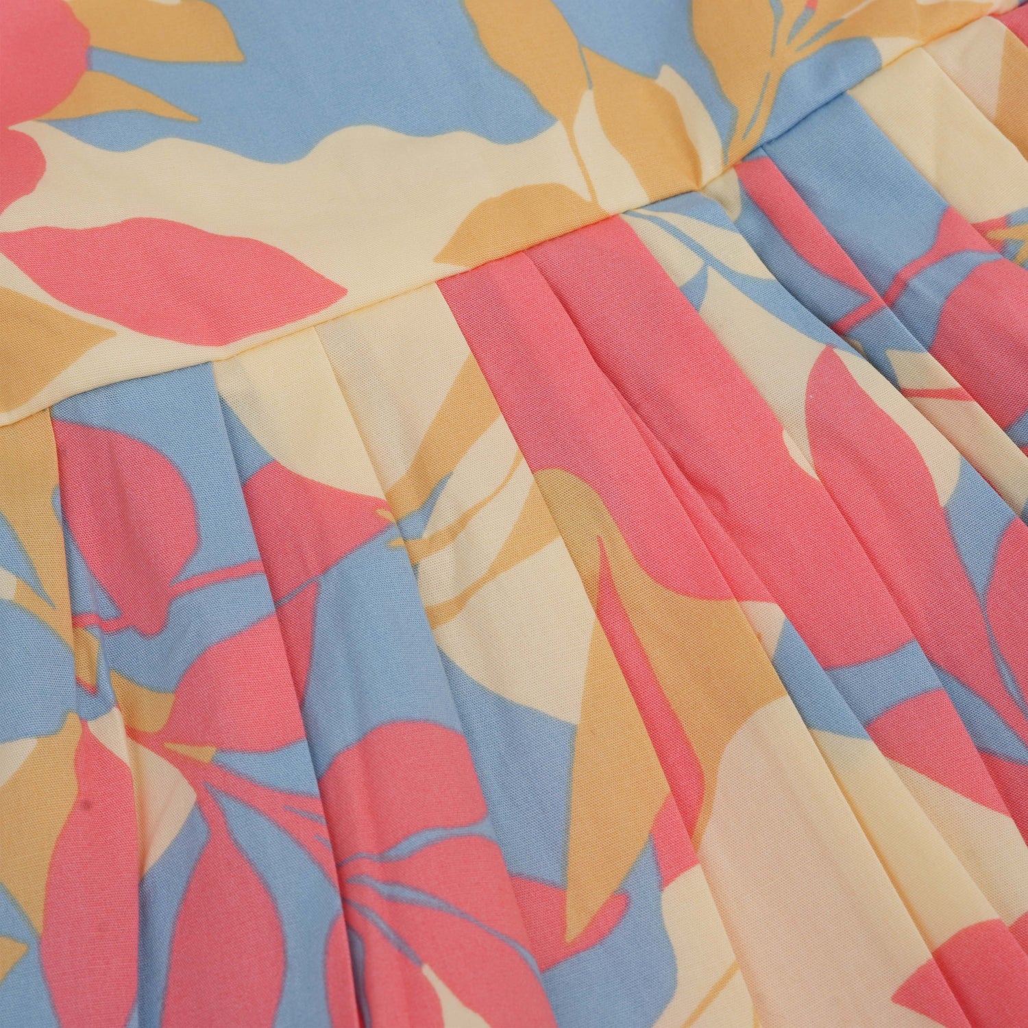 Colorful cotton frock with leaf print and cap sleeves. Ages 6M–5Y. Soft, breathable, and made for twirls!
