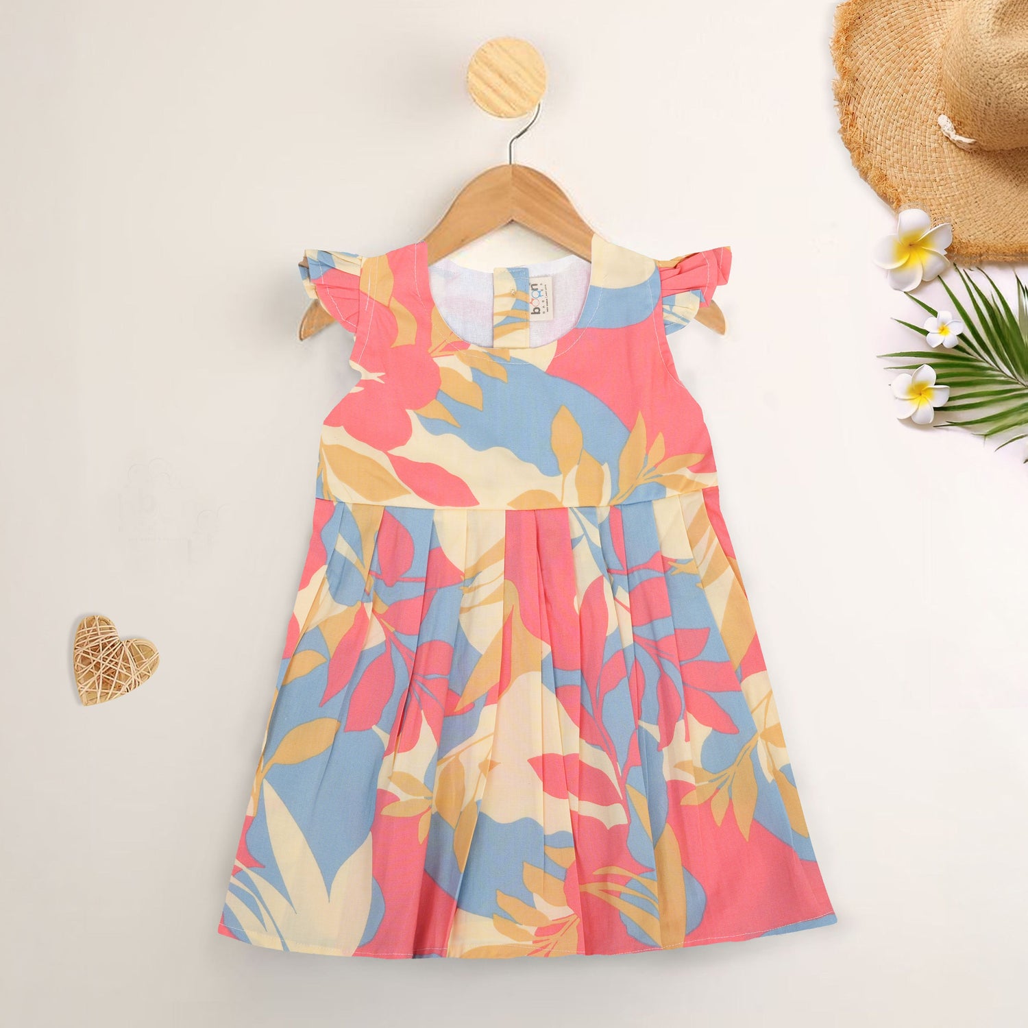 Colorful cotton frock with leaf print and cap sleeves. Ages 6M–5Y. Soft, breathable, and made for twirls!
