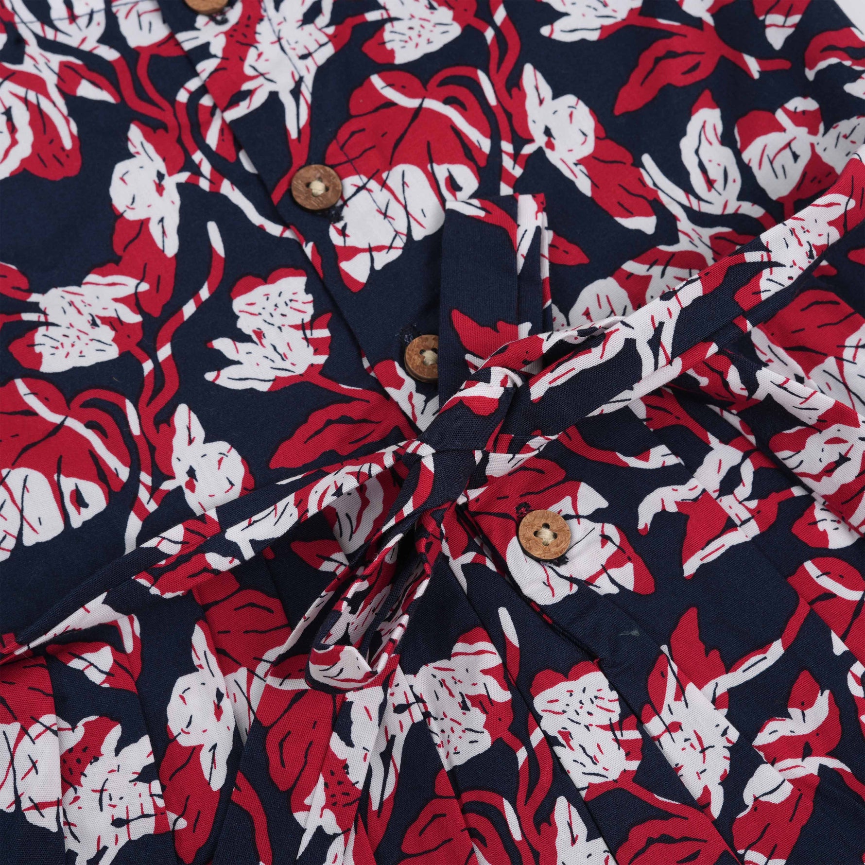 Bold navy cotton frock with red & white florals. Made for 6M–5Y girls. Twirl-ready, comfy, and cute!
