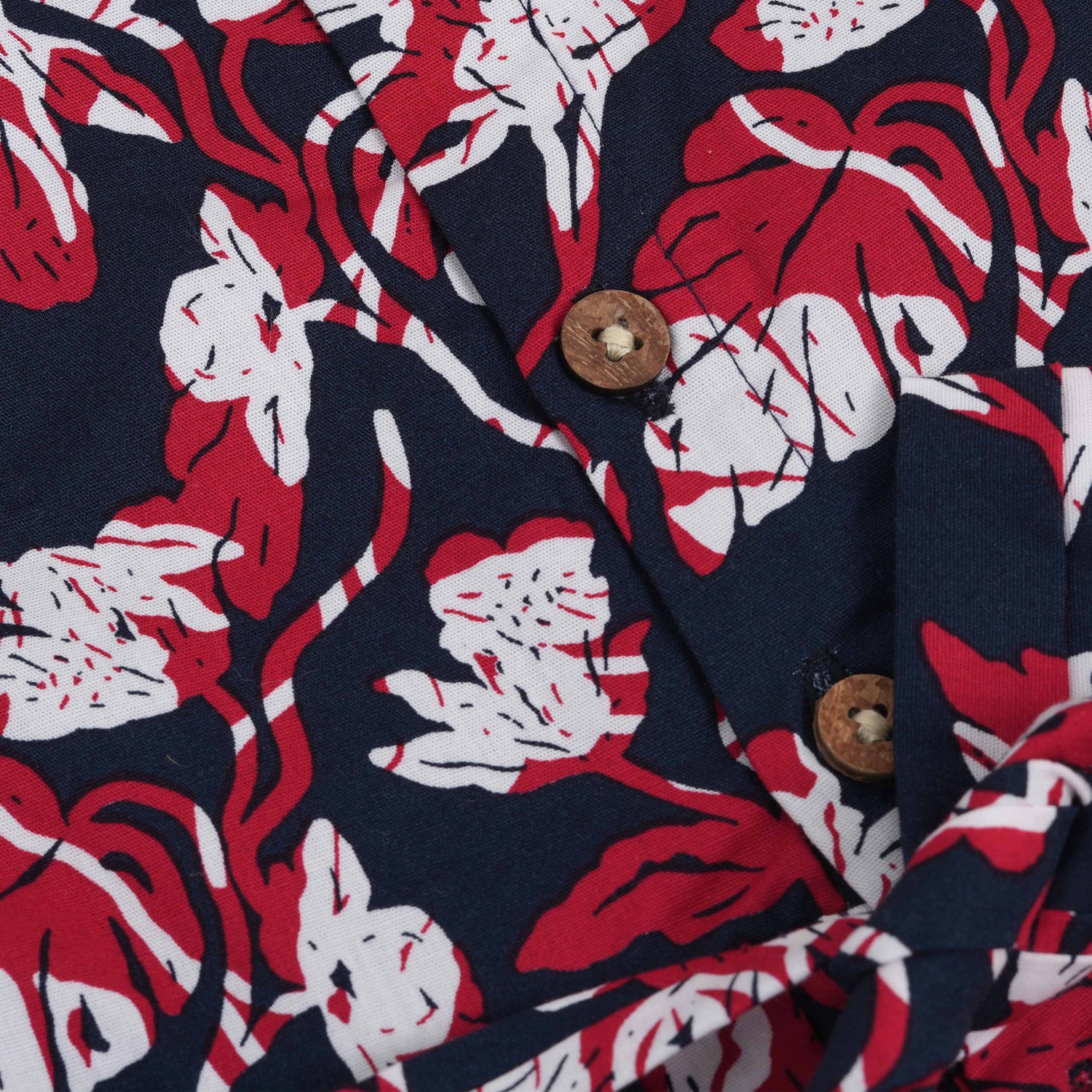 Bold navy cotton frock with red & white florals. Made for 6M–5Y girls. Twirl-ready, comfy, and cute!
