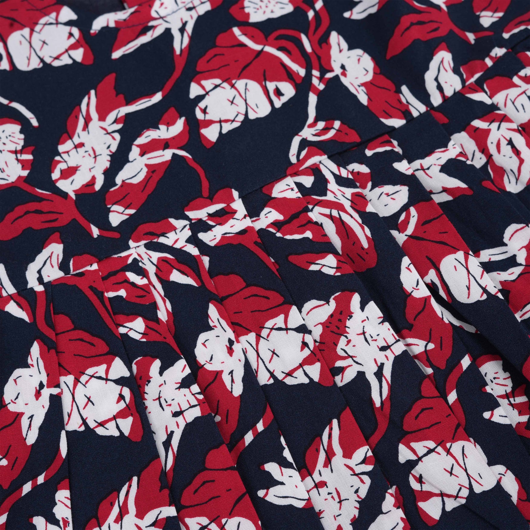 Bold navy cotton frock with red & white florals. Made for 6M–5Y girls. Twirl-ready, comfy, and cute!
