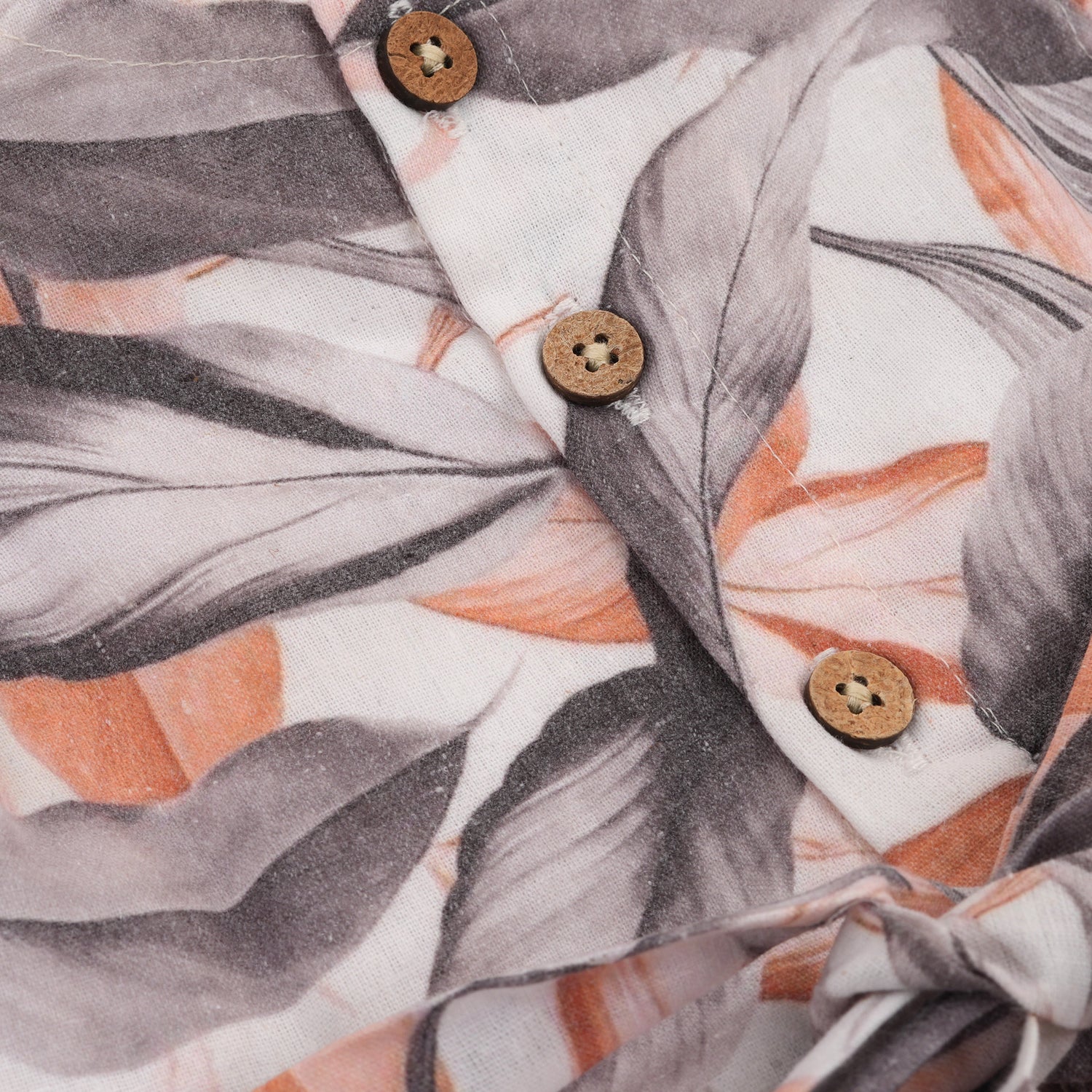 Elegant cotton frock with peach & grey leaf print and cap sleeves. Ideal for girls aged 6M to 5Y.