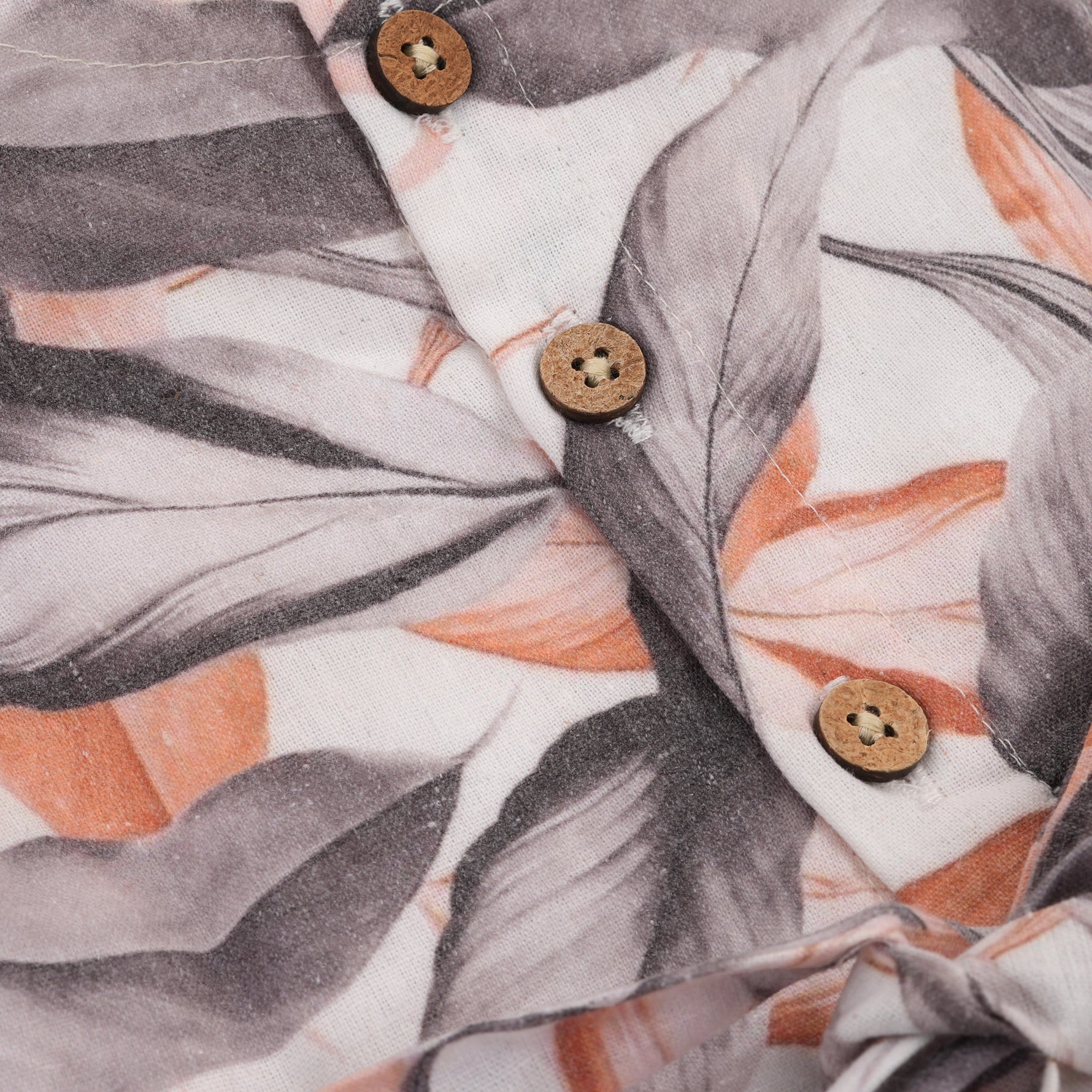 Elegant cotton frock with peach & grey leaf print and cap sleeves. Ideal for girls aged 6M to 5Y.