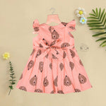 Peach cotton frock with bold leaf print and flutter sleeves. Made for girls aged 6 months to 5 years. Soft, breathable, and perfect for summer wear.
