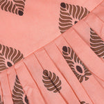 Peach cotton frock with bold leaf print and flutter sleeves. Made for girls aged 6 months to 5 years. Soft, breathable, and perfect for summer wear.

