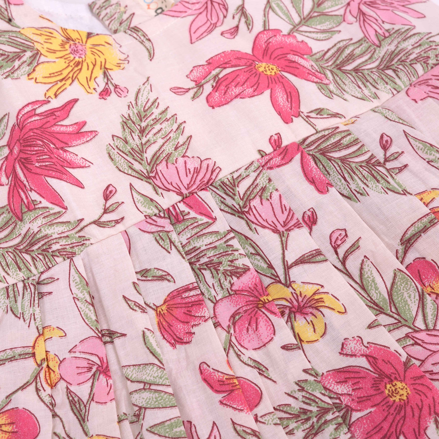 Bright floral cotton frock with cap sleeves for girls aged 6M to 5Y. Light, breathable & picture-perfect!
