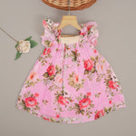 Adorable pink floral frock with ruffle sleeves in breathable linen. Sizes 6M–4Y. Perfect for stylish little girls.
