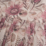 Pink floral cotton frock for girls with ruffle cap sleeves, designed for 6 months to 5 years – from Boon Babies clothing collection in Coimbatore.
