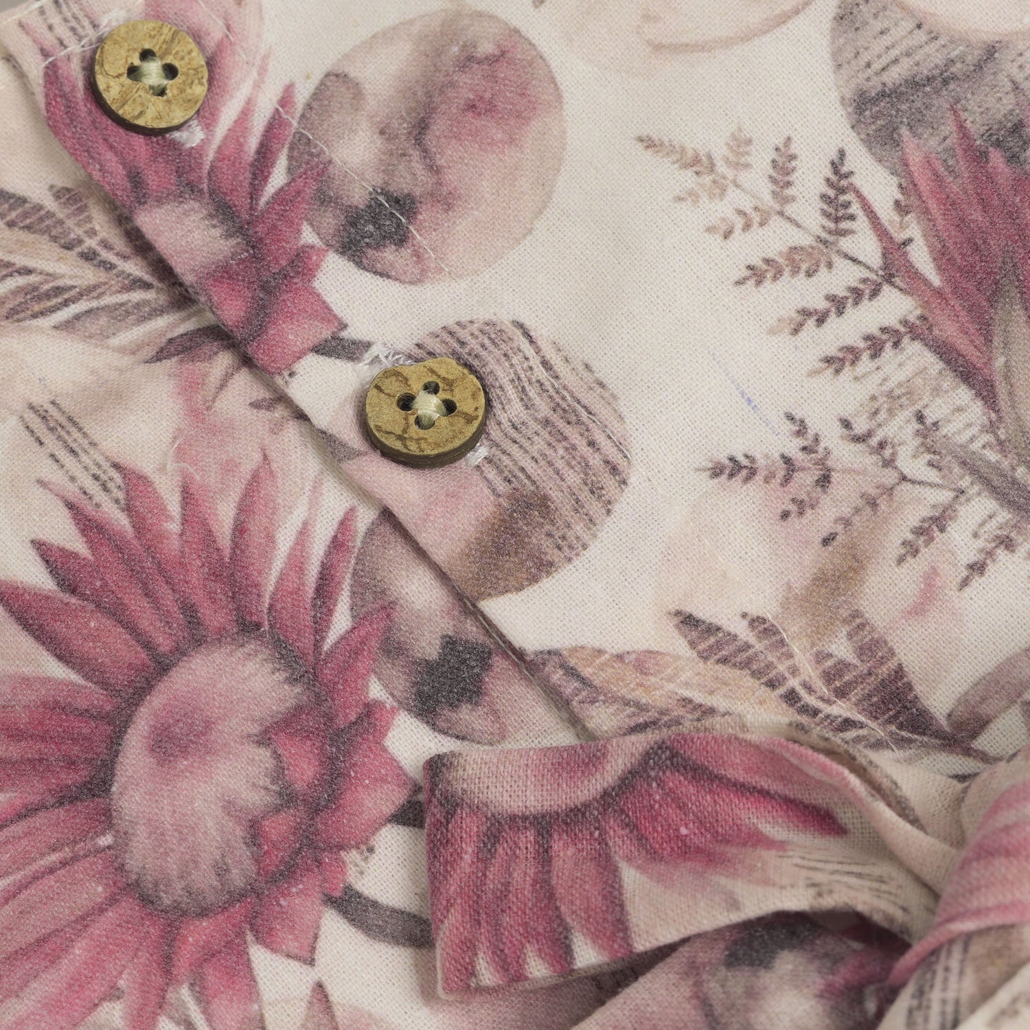 Pink floral cotton frock for girls with ruffle cap sleeves, designed for 6 months to 5 years – from Boon Babies clothing collection in Coimbatore.
