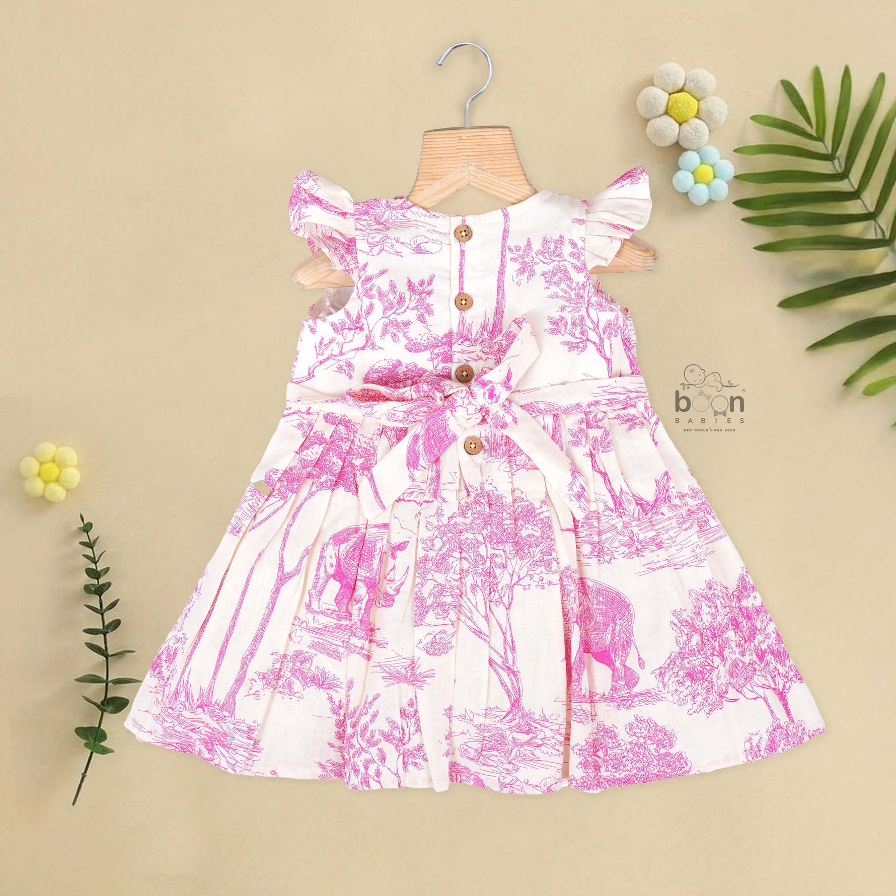 Pink wildlife print cotton frock with flutter sleeves for girls aged 6 months to 5 years. Breathable, soft and playful design from Boon Babies.
