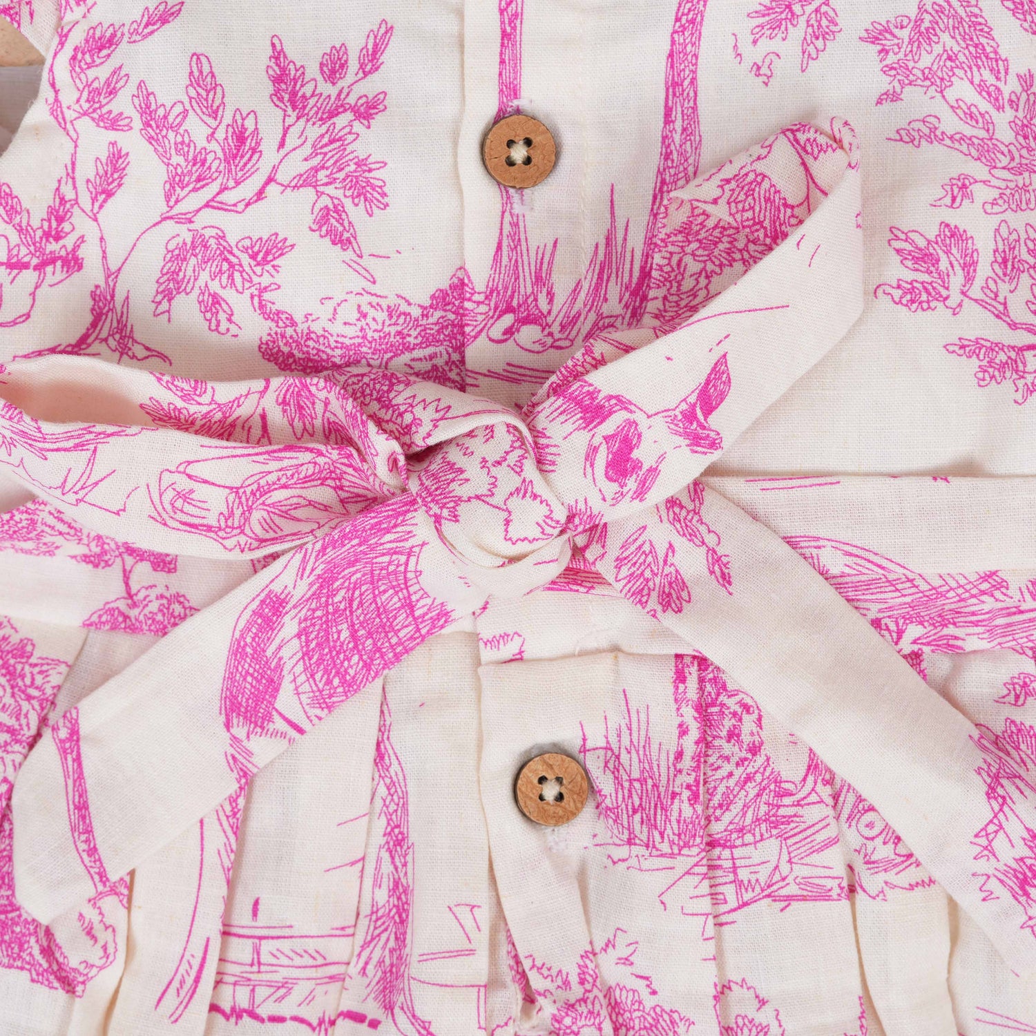 Pink wildlife print cotton frock with flutter sleeves for girls aged 6 months to 5 years. Breathable, soft and playful design from Boon Babies.
