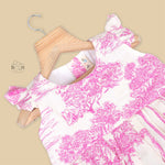 Pink wildlife print cotton frock with flutter sleeves for girls aged 6 months to 5 years. Breathable, soft and playful design from Boon Babies.
