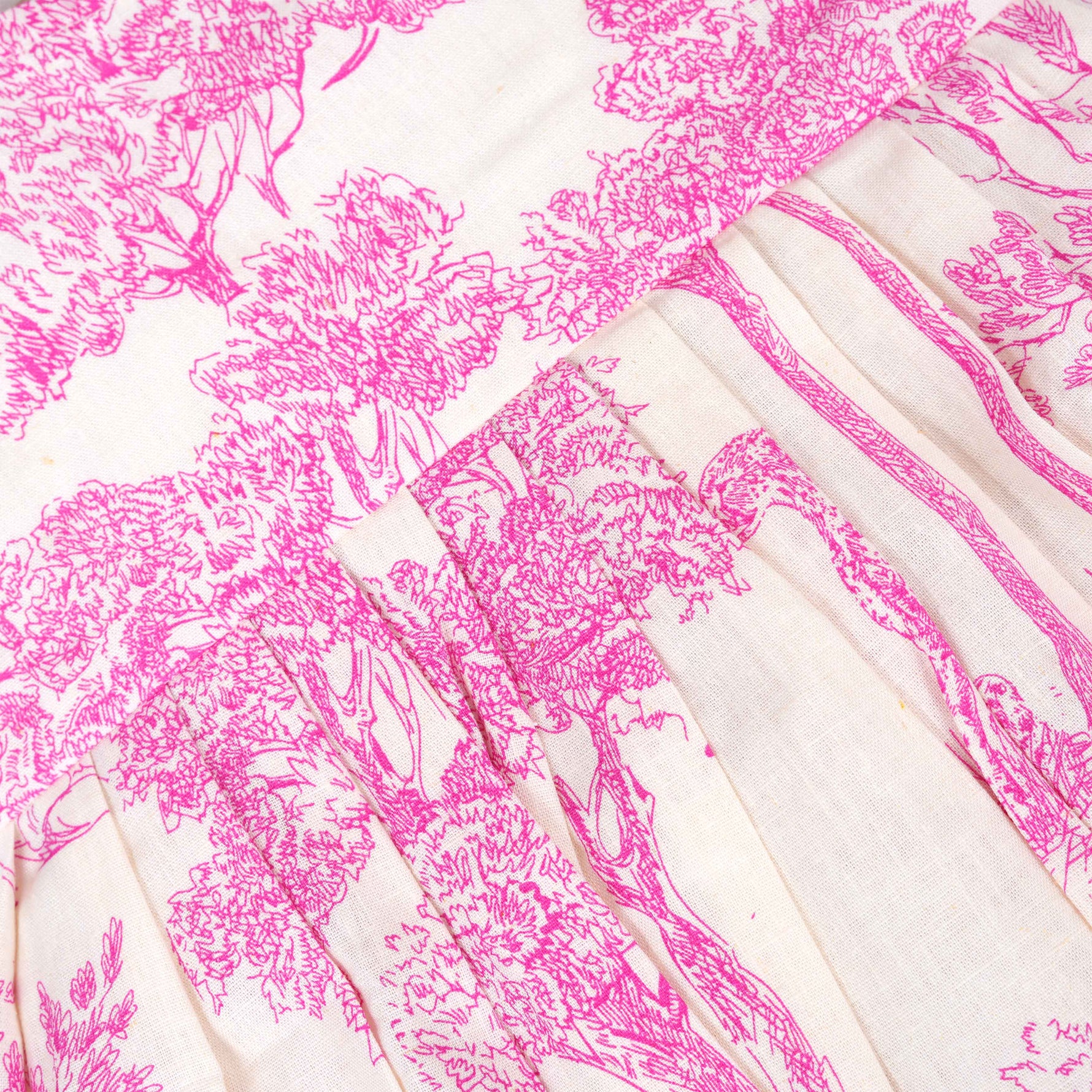 Pink wildlife print cotton frock with flutter sleeves for girls aged 6 months to 5 years. Breathable, soft and playful design from Boon Babies.
